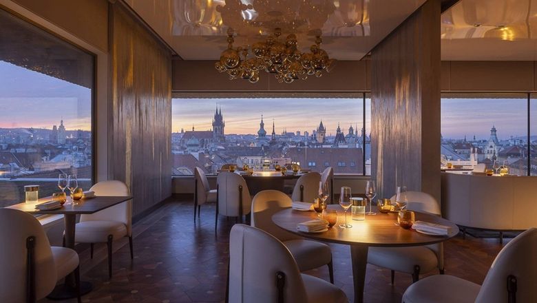 Zlata Praha Restaurant at Fairmont Prague offers modern Czech cuisine with panoramic city views, a romantic ambiance, and a rooftop terrace for a memorable dining experience.